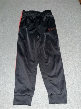 Nike Kids Black Joggers with Red Trim